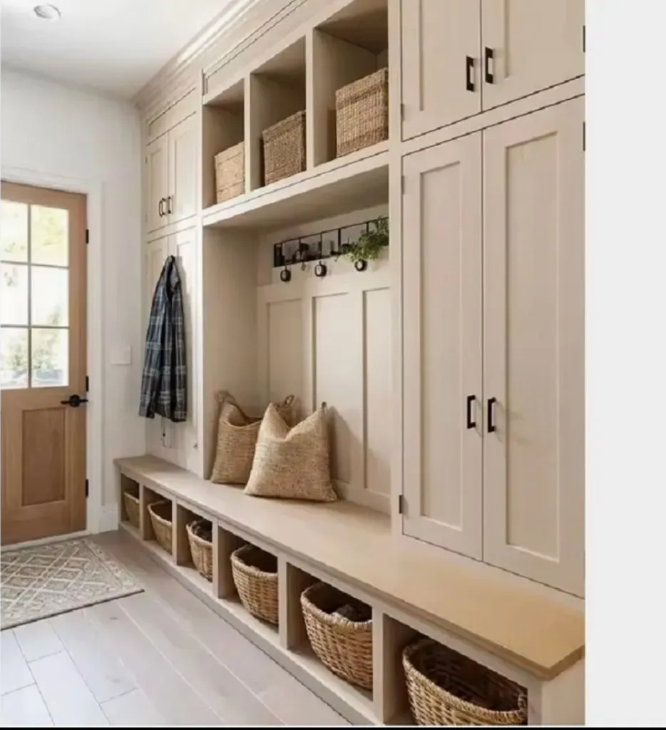 Cream hallway cabinetry beside a wooden door