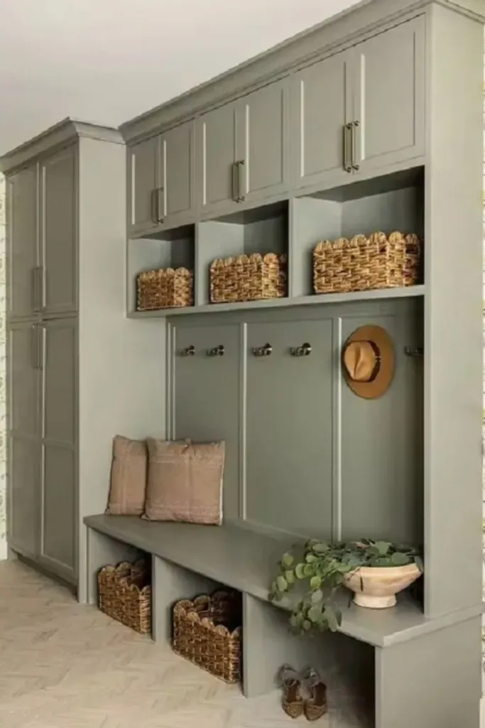 Sage green bench niche with coat hooks