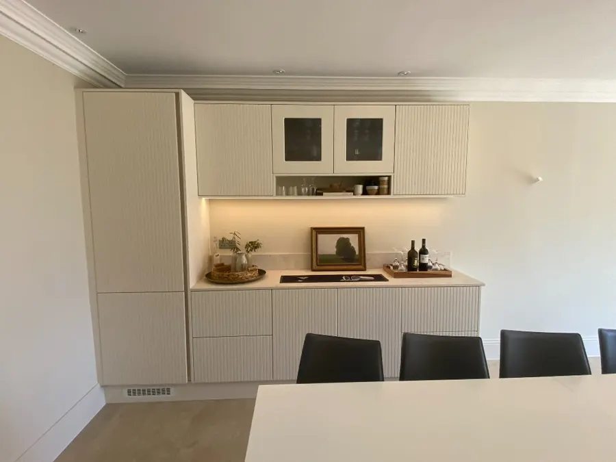 Fluted bar counter with under-cabinet LED glow