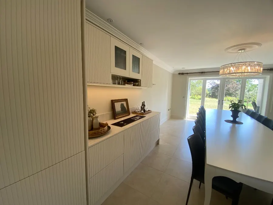 Side view of fluted drinks cabinet with glass niche